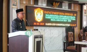 Bupati Kab. Gorontalo Utara, Thariq Modanggu saat menyampaikan pidato perdannya di hadapan anggota DPRD Gorut. Foto: simpulido