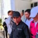 Terduga Pelaku Korupsi Hibah Koni, FM (Tenga, topi putih). Foto: Juna