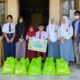 Pembagian bantuan kepada anak yatim oleh PT Biomasa Group. (Foto: Istimewa)